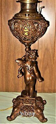 1880's Brass Cherub & Snake Detailed Ornate Electrified Oil Lamp with Pink Shade
