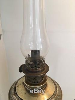 19th century French Neoclassical style brass oil lamp, lion paw feet putti
