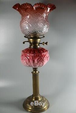 A Large Good Quality Cranberry Twin Duplex Table Oil Lamp