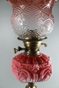 A Large Good Quality Cranberry Twin Duplex Table Oil Lamp