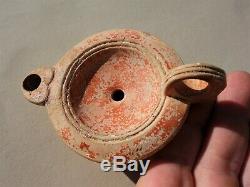 Ancient Roman pottery oil lamp with elegant design by 1 century AD