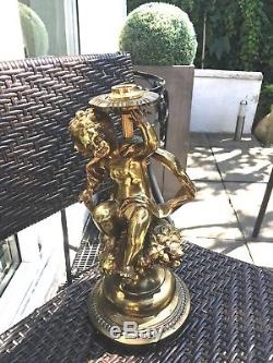 Antique brass cherub oil lamp putti