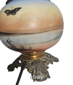 Antique gone with the wind style oil lamp converted to use electric light bulb