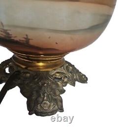 Antique gone with the wind style oil lamp converted to use electric light bulb
