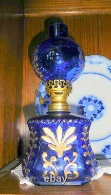 Antique miniature cobalt glass oil lamp with gilt embossing