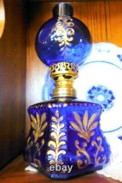 Antique miniature cobalt glass oil lamp with gilt embossing