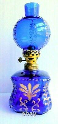 Antique miniature cobalt glass oil lamp with gilt embossing