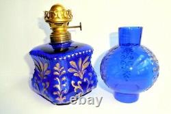 Antique miniature cobalt glass oil lamp with gilt embossing