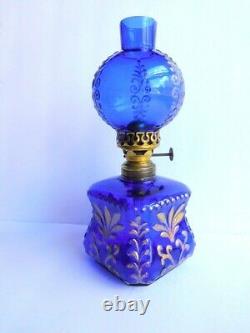 Antique miniature cobalt glass oil lamp with gilt embossing