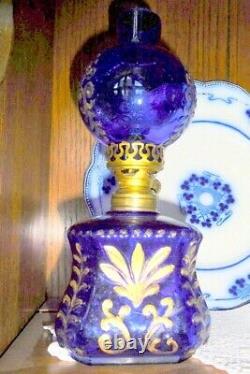 Antique miniature cobalt glass oil lamp with gilt embossing