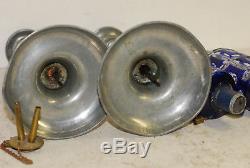 Pair Sandwich glass whale oil lamps, blue cut to clear, on pewter push-up sticks