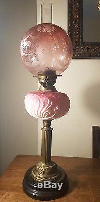 Stunning cranberry glass oil lamp