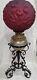 Victorian Gwtw Oil Lamp Consolid Iris Ruby Red Globe & Wrought Iron Ornate Base