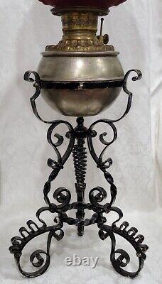 Victorian Gwtw Oil Lamp Consolid Iris Ruby Red Globe & Wrought Iron Ornate Base