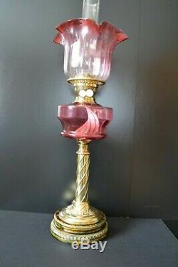 Victorian twin burner oil lamp. Cranberry font and shade