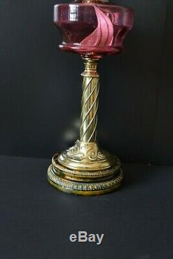 Victorian twin burner oil lamp. Cranberry font and shade