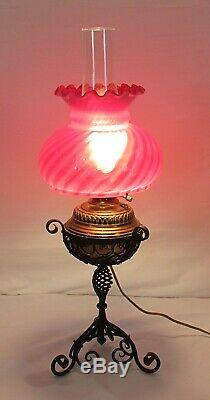 Vintage antique banquet parlor oil lamp with cranberry swirl design shade