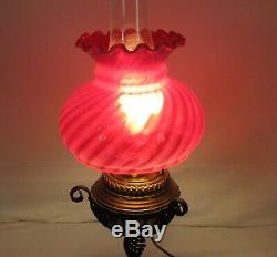 Vintage antique banquet parlor oil lamp with cranberry swirl design shade